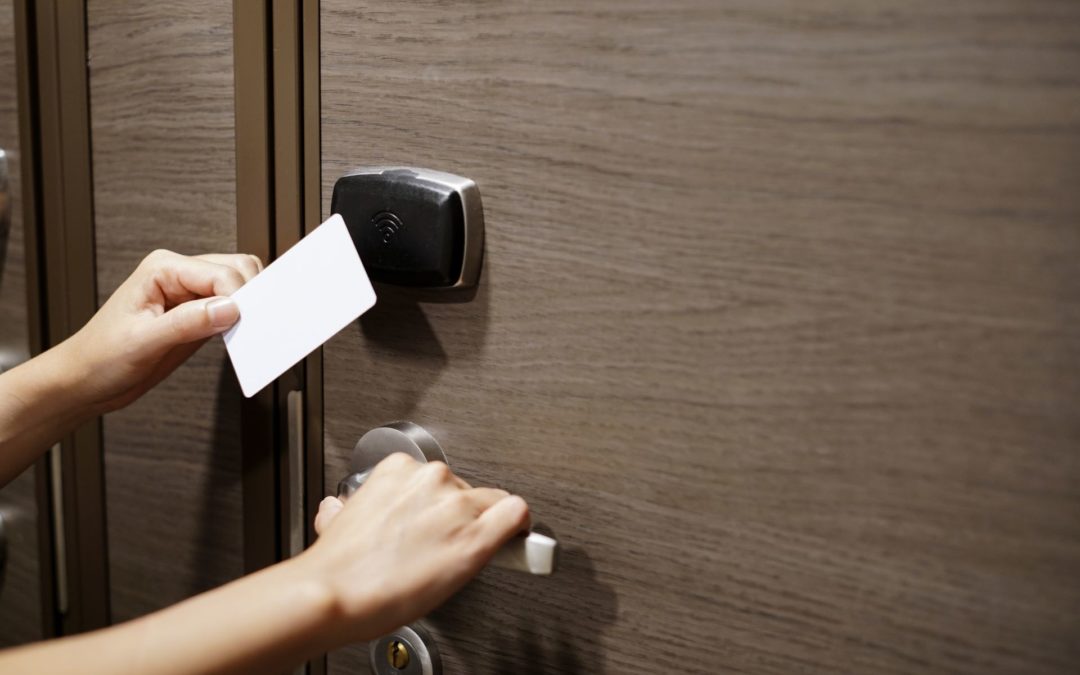A woman uses an access control system to get into a secure room