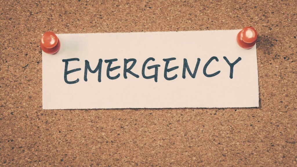 A sign that says "emergency," written for those who may need an emergency locksmith