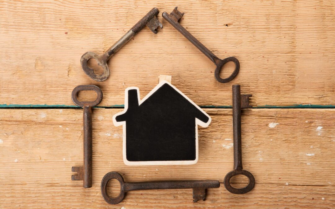 A small plastic house surrounded by keys, symbolizing home security and home security problems